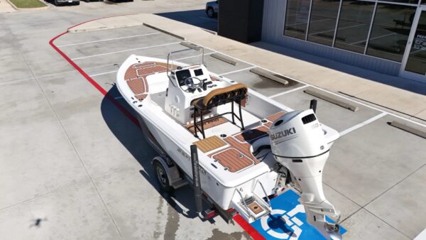 2020 Sea Pro 208 Bay with outboard motor and wooden accents on display.