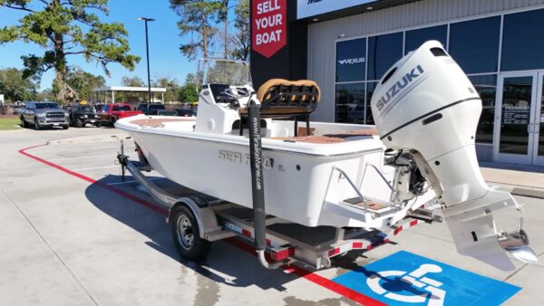 2020 Sea Pro 208 Bay with Suzuki outboard motor on a dual-axle trailer.